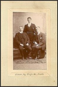 Scan 43.  is labeled by the back left to right as James W. Dey, David Dey, and John Torrance, (standing.
